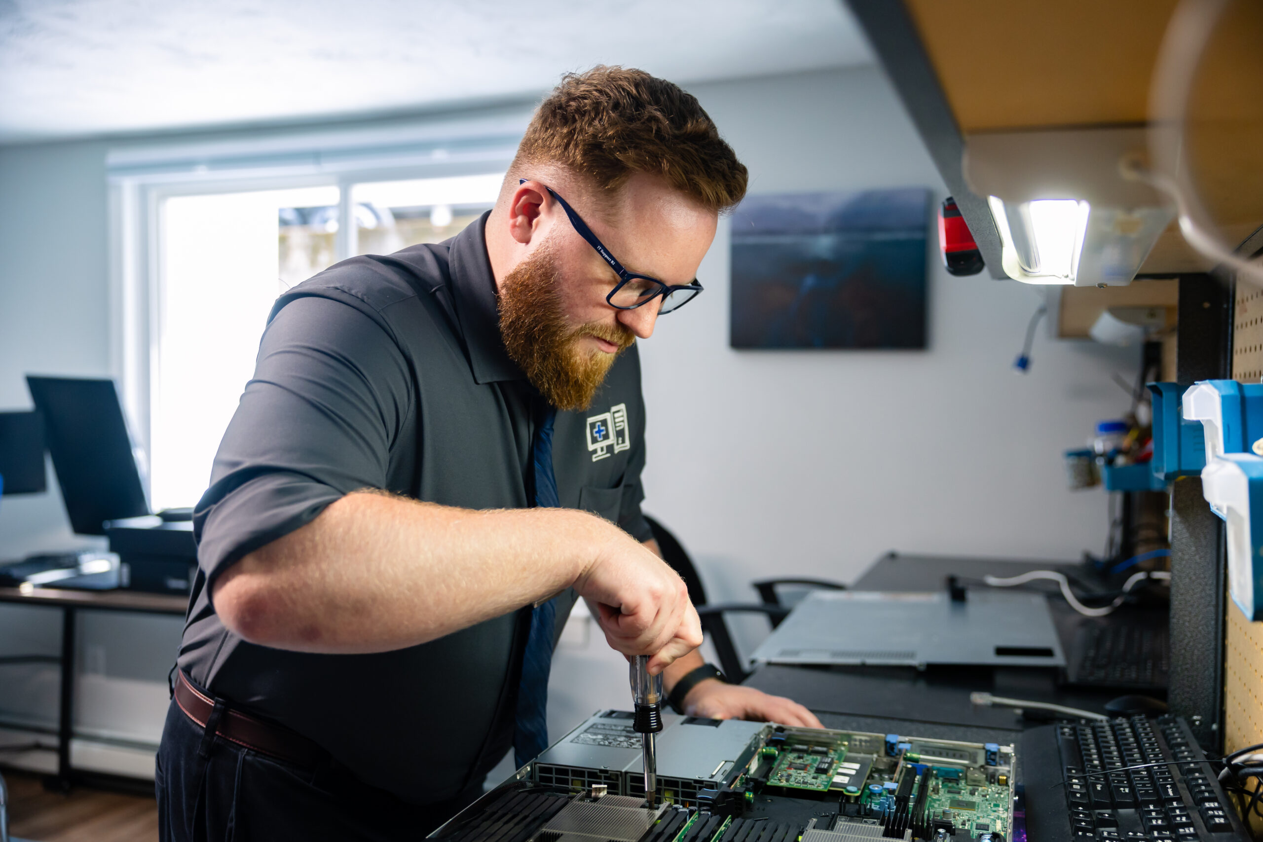 A Technician is working on a server.